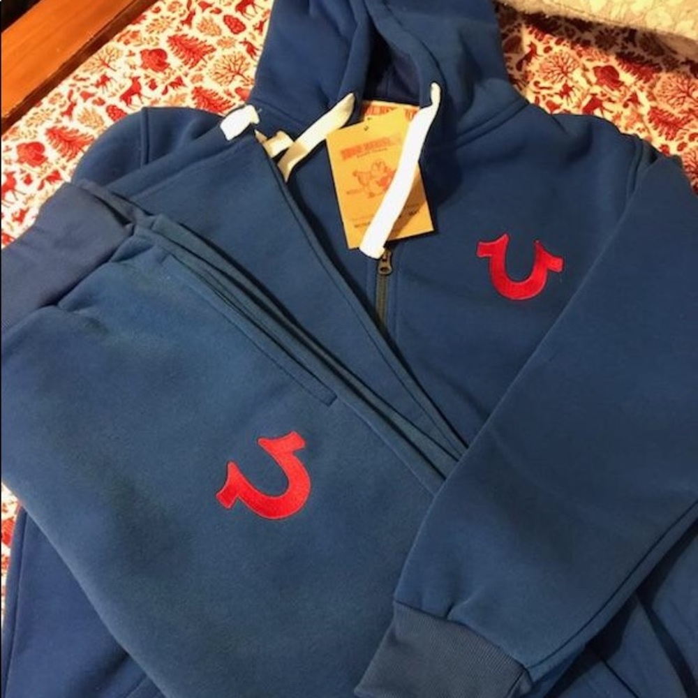 Royal blue suit with red logo